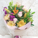 Bouquet of roses, lilies, stock, chrysanthemums and greenery